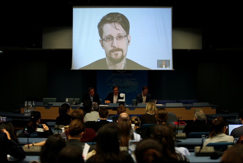 FILE PHOTO - Snowden speaks via video link as he takes part in a round table on the protection of whistleblowers at the Council of Europe in Strasbourg