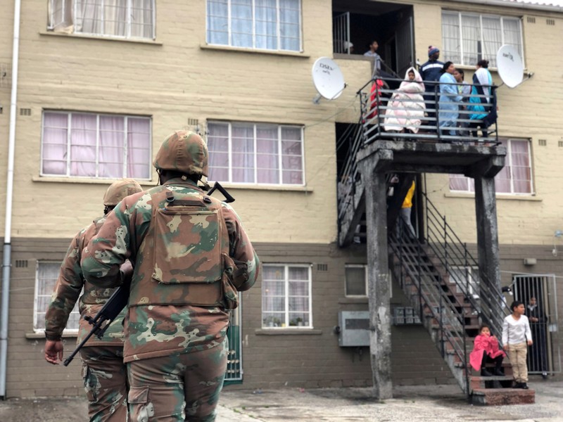 FILE PHOTO: Soldiers patrol against gang violence in Manenberg township, Cape Town, South Africa