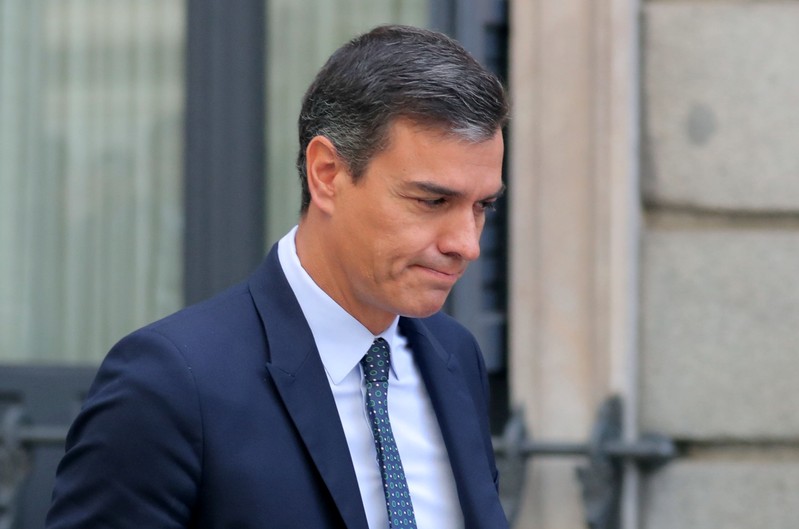 Spain's acting Prime Minister Pedro Sanchez leaves after attending weekly cabinet control session at Parliament in Madrid