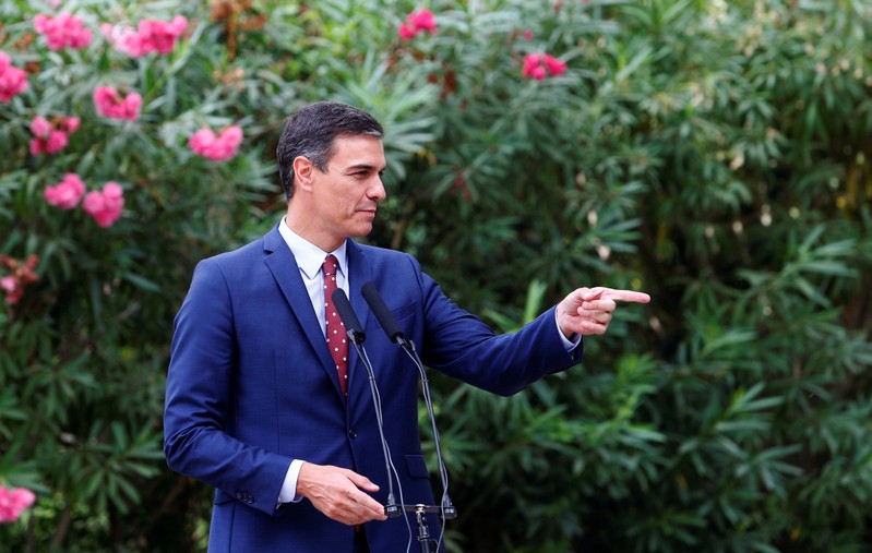 FILE PHOTO: Spain's Prime Minister Pedro Sanchez speaks during a brief news conference after his traditional summer meeting with King Felipe at Marivent Palace