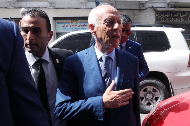 Presidential candidate Kais Saied arrives at his campaign headquarters in Tunis
