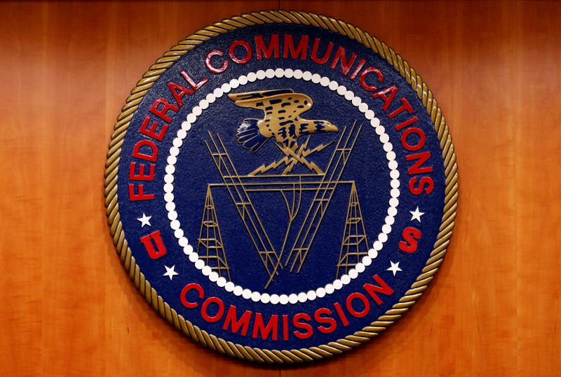 FILE PHOTO: The Federal Communications Commission (FCC) logo is seen before the FCC Net Neutrality hearing in Washington
