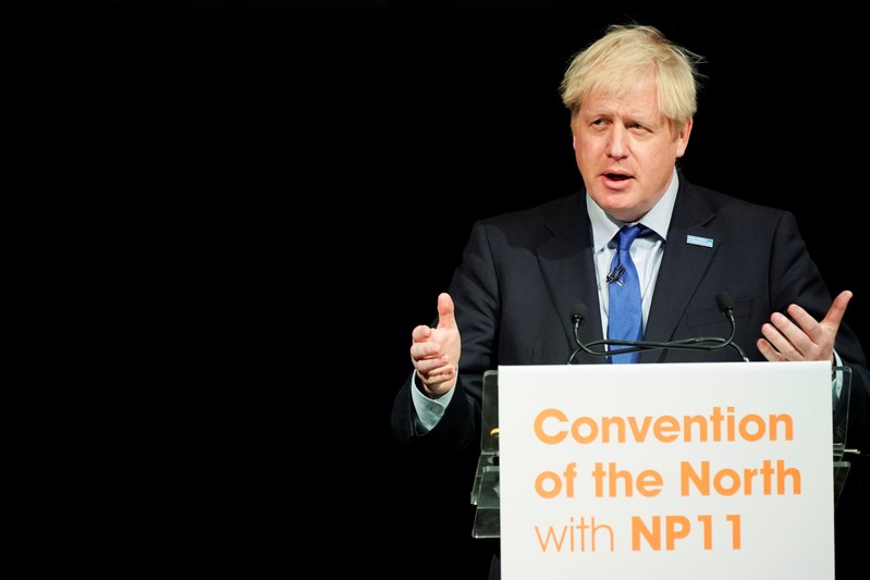 Britain's Prime Minister Boris Johnson gestures as he speaks during the Convention of the North at the Magna Centre in Rotherham