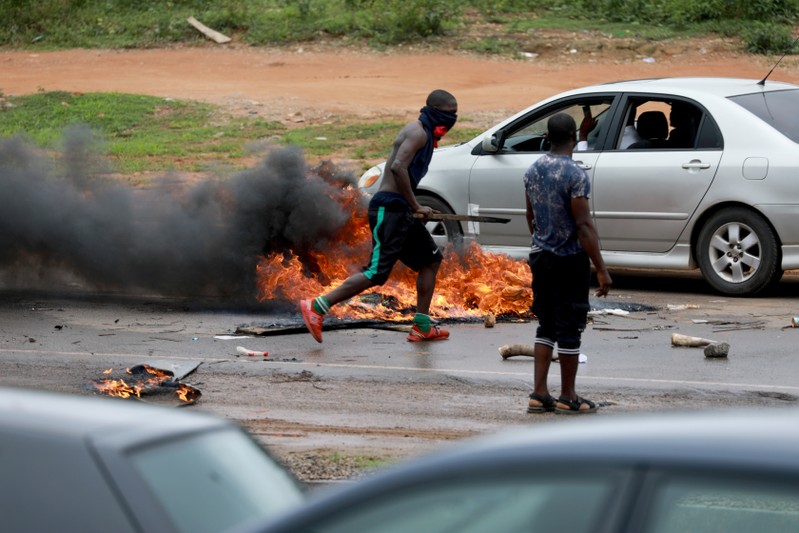 Protesters set fires in the road to try to set up barricades in Abuja