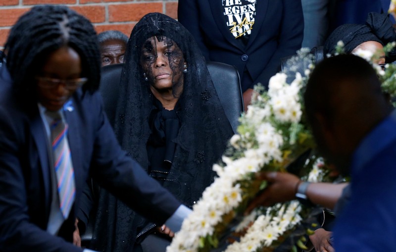 Grace Mugabe, widow of former Zimbabwean President Robert Mugabe stands behind a wreath at his burial site in Kutama, Zimbabwe