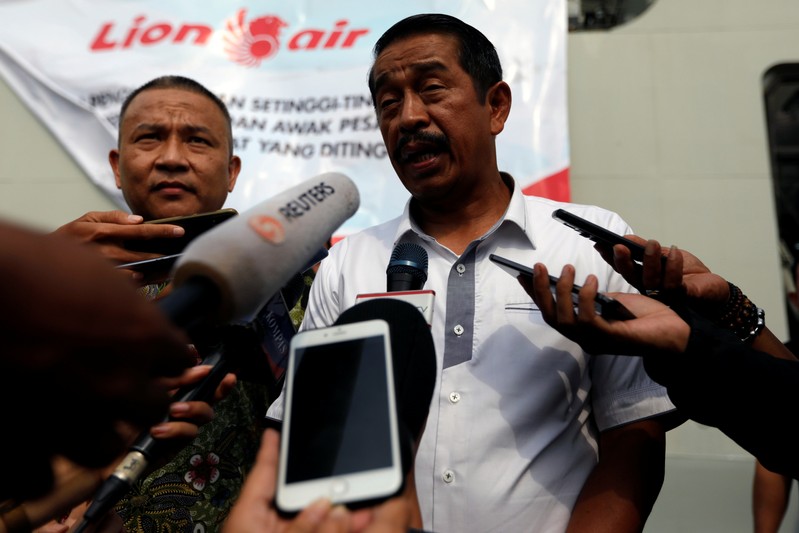 CEO of Lion Air Group Edward Sirait talks to journalists as he arrives at Jakarta International Port after attending one-year commemoration of the Lion Air JT-610 which crashed at Java sea, in Jakarta