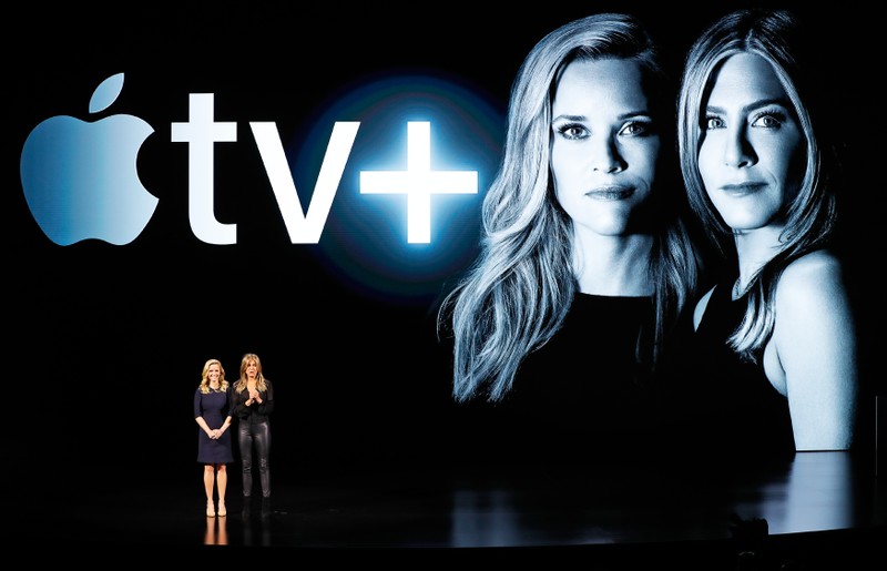 Actors Reese Witherspoon (L) and Jennifer Aniston speak during an Apple special event at the Steve Jobs Theater in Cupertino