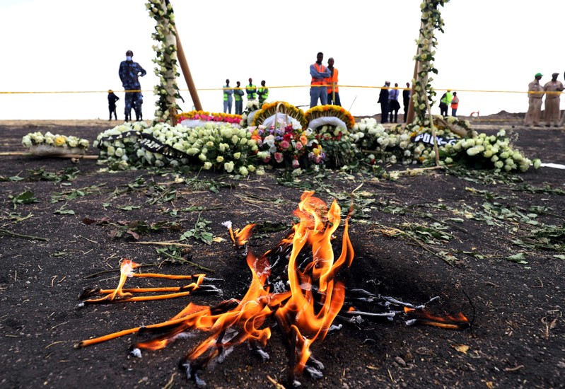 FILE PHOTO: Candle flames burn during a commemoration ceremony for the victims at the scene of the Ethiopian Airlines Flight ET 302 plane crash, near the town Bishoftu