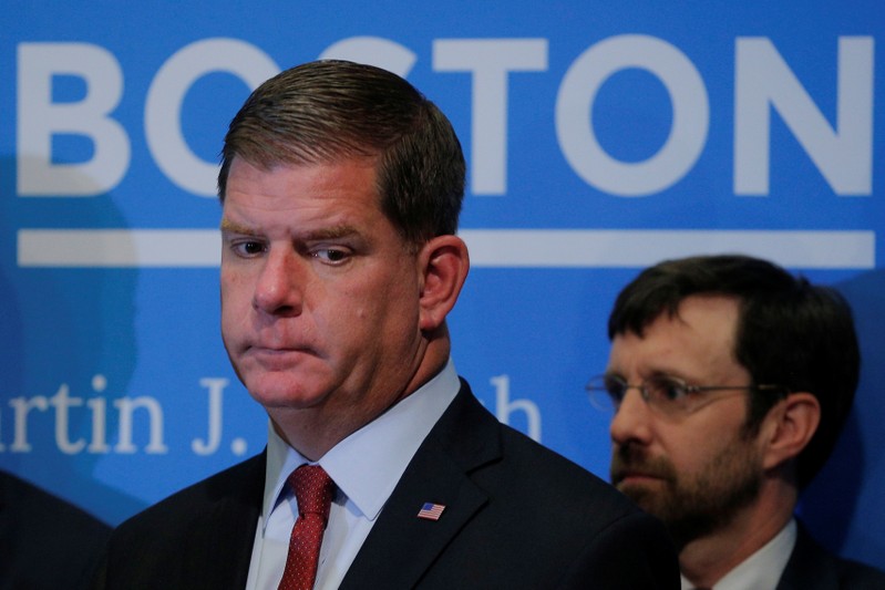 Boston Mayor Walsh listens during a news conference to urge U.S. President Trump not to withdraw from the Paris Climate Accord at City Hall in Boston