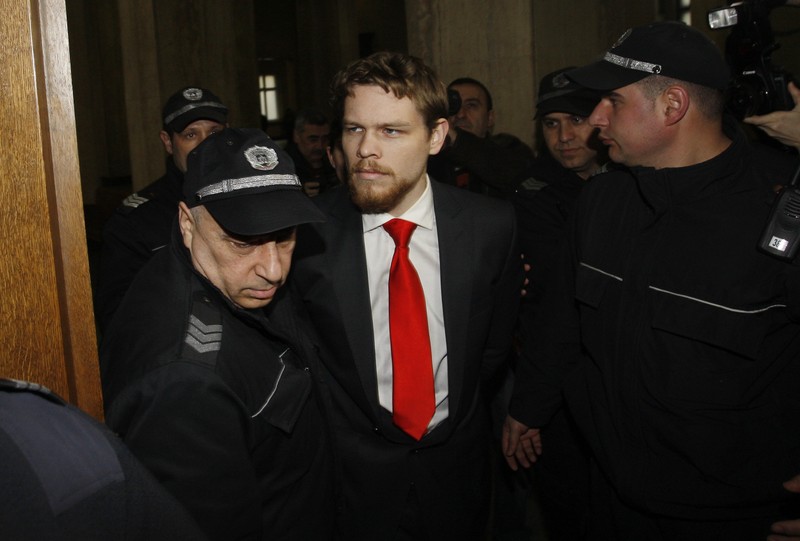 FILE PHOTO: Australian Palfreeman is escorted by Bulgarian policemen before start of hearing of his appeal case in Court of Appeal in Sofia