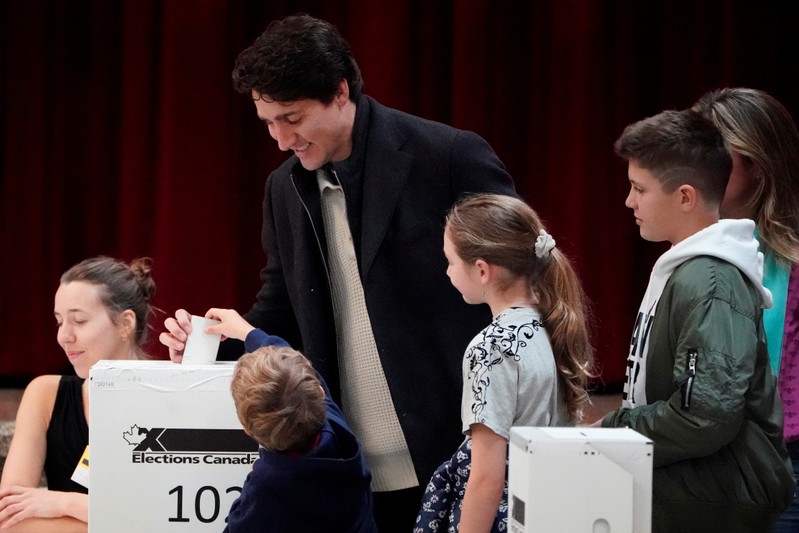 Justin Trudeau, with his family, puts his ballot for today's election in the ballot box in the Papineau area of Montreal