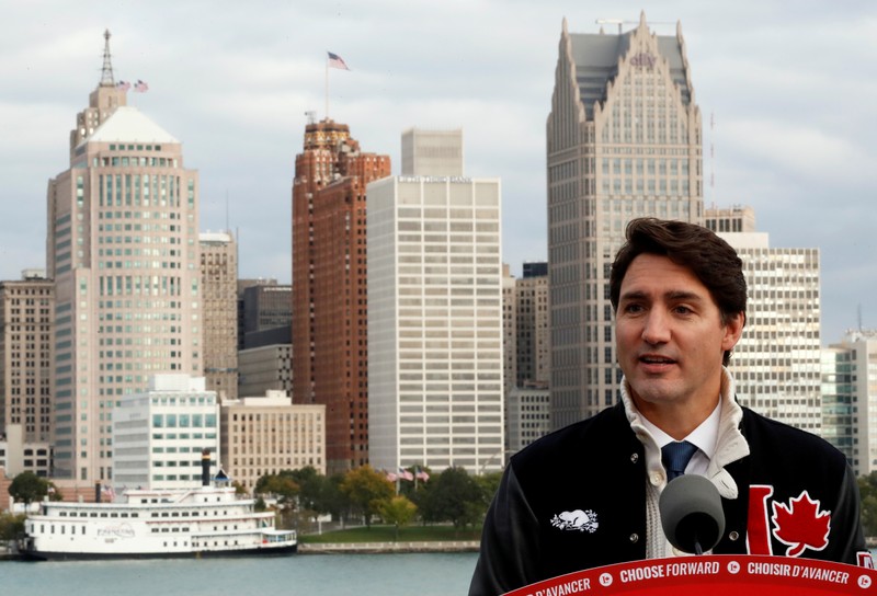 Liberal leader and Canadian Prime Minister Justin Trudeau delivers a speech with city skyline of Detroit in the United States in the background, during an election campaign visit to Windsor