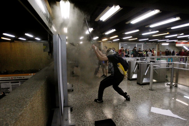 Demonstrators protest against the increase in the subway ticket prices in Santiago