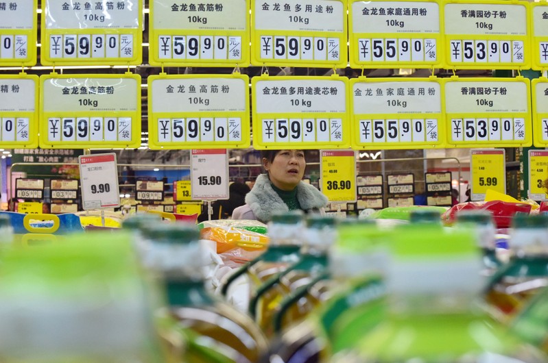 FILE PHOTO: Customer shops at a supermarket in Handan, Hebei