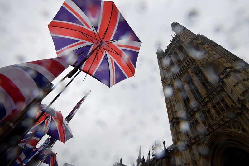 Union Jack flags are seen outside the Houses of Parliament in London
