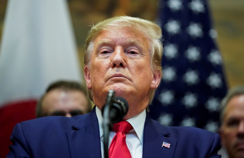 U.S. President Donald Trump speaks about impeachment investigation during signing ceremony for the U.S.-Japan Trade Agreement at White House in Washington