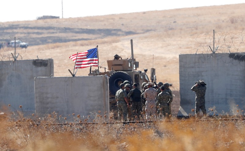 FILE PHOTO: Turkish and U.S. troops meet on the Turkish-Syrian border for a joint U.S.-Turkey patrol in northern Syria, as it is pictured from near the Turkish town of Akcakale