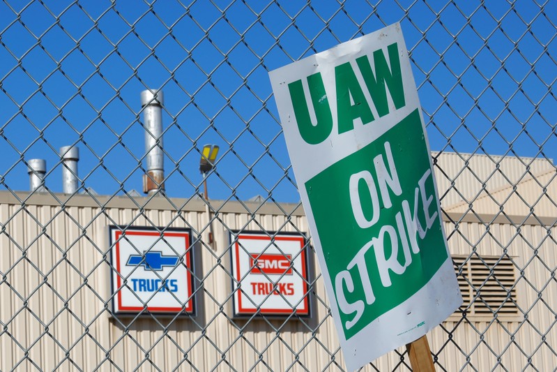 FILE PHOTO: A union strike sign is stuck in the fence outside the GM Flint Truck Assembly in Flint