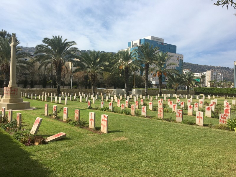 Graffiti of swastikas and other signs can be seen on headstones at the Haifa War Cemetery, where about 350 Commonwealth soldiers killed in World War One and World War Two are buried, Israel