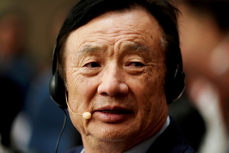 FILE PHOTO: Huawei founder Ren Zhengfei attends a panel discussion at the company headquarters in Shenzhen