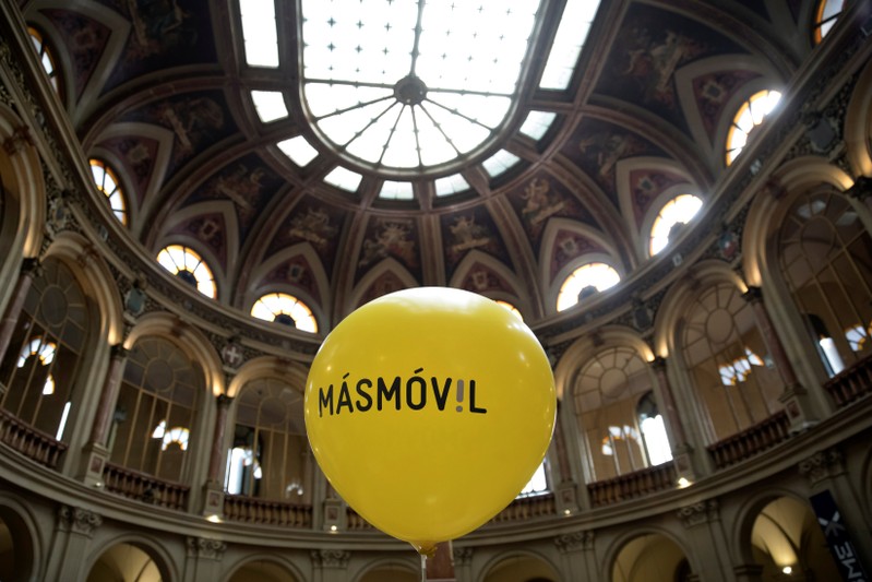 FILE PHOTO: A balloon with the logo of Masmovil is seen during its bourse debut in Madrid