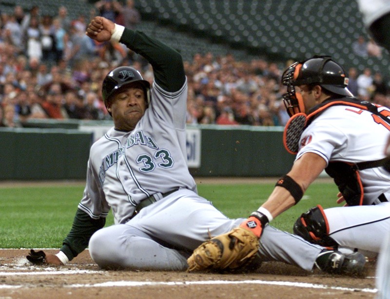 DEVIL RAYS PEREZ TAGGED OUT AT HOME BY ORIOLES LOPEZ IN BALTIMORE.