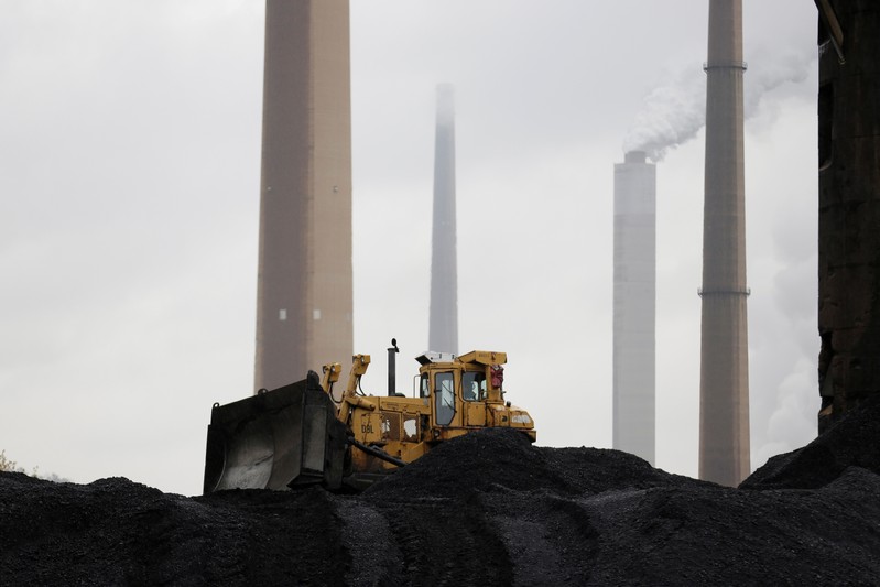 FILE PHOTO: A bulldozer moves coal at the Murray Energy Corporation port facility in Powhatan Point, Ohio