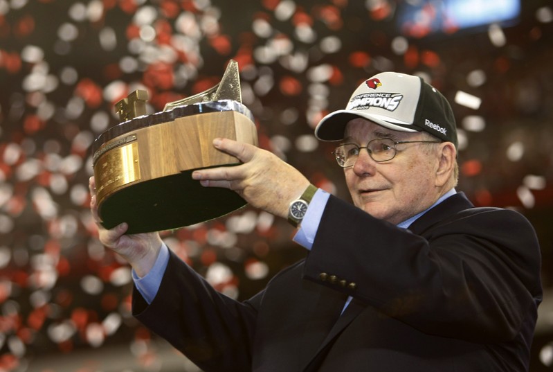 FILE PHOTO: Arizona Cardinals owner Bill Bidwell raises the trophy after his team defeated the Philadelphia Eagles in the NFL's NFC Championship in Glendale