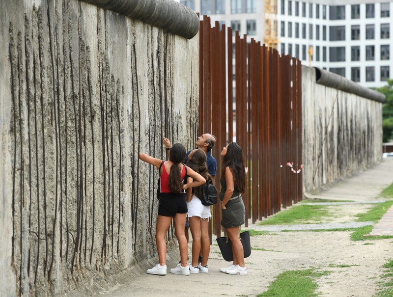 FILE PHOTO: People visit the Berlin Wall memorial site in Bernauer Strasse in Berlin