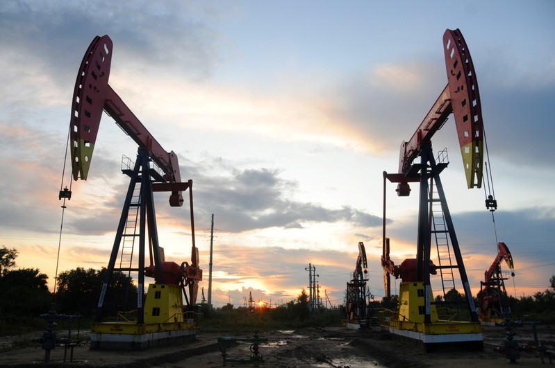 FILE PHOTO: Pumpjacks are seen during sunset at the Daqing oil field in Heilongjiang