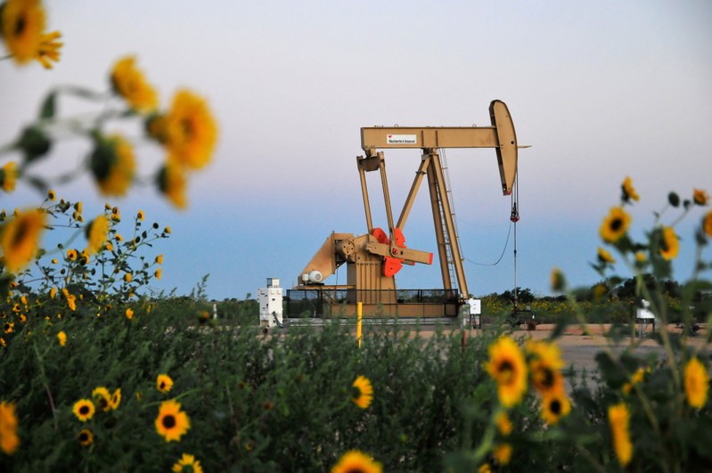 FILE PHOTO: A pump jack operates at a well site leased by Devon Energy Production Company near Guthrie, Oklahoma