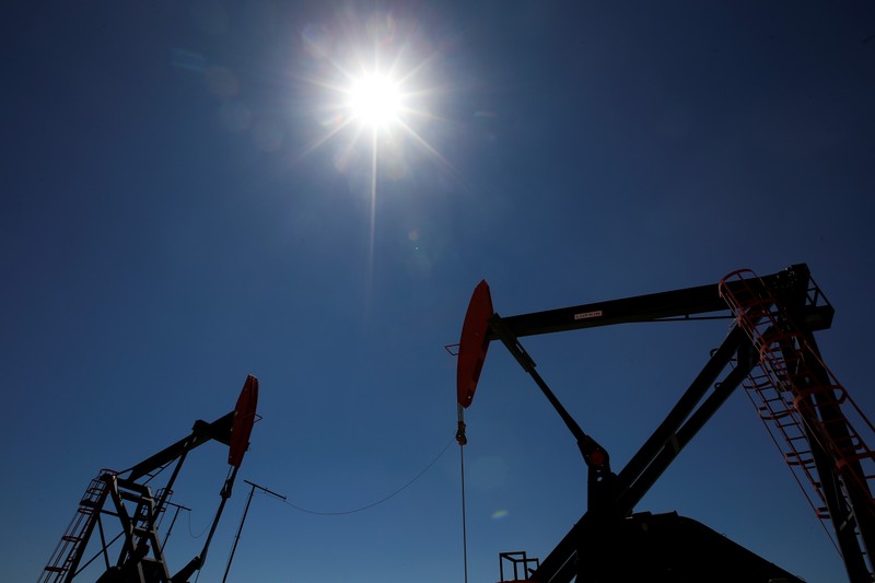 FILE PHOTO: Oil rigs are seen at Vaca Muerta shale oil and gas drilling, in the Patagonian province of Neuquen