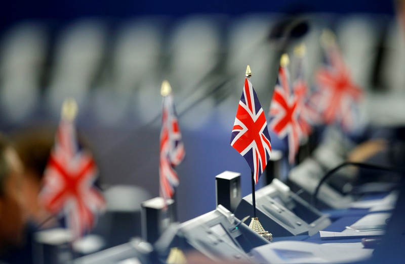 British Union Jack flags are seen on the desks of Members of the Brexit Party during a debate on the last European summit, at the European Parliament in Strasbourg