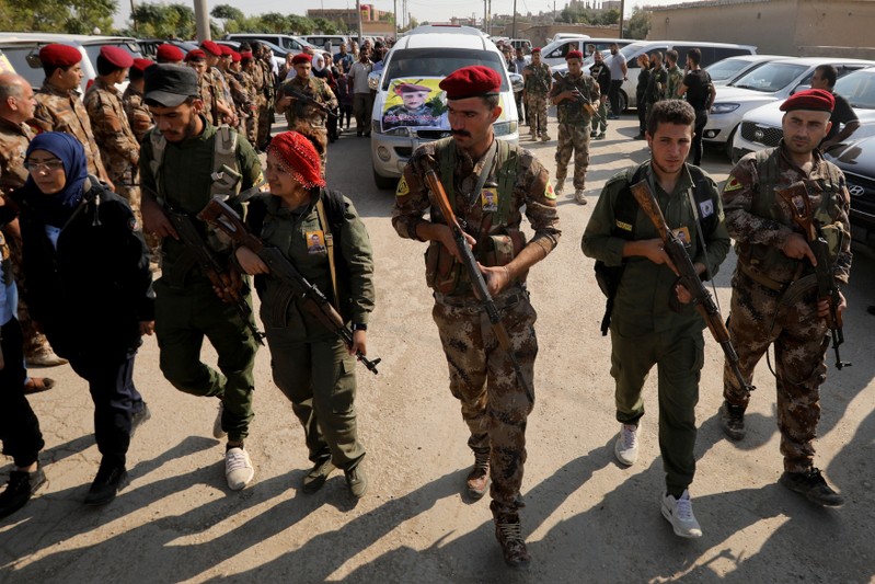 FILE PHOTO: Funeral procession of Kurdish fighters in the town of Qamishli