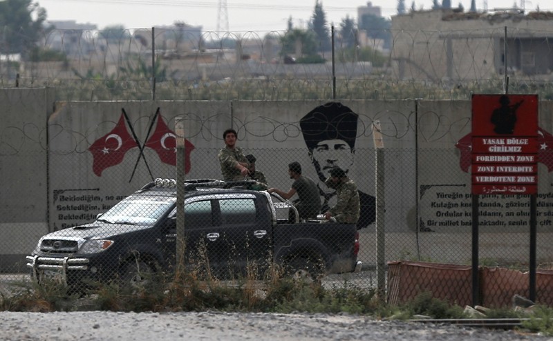 FILE PHOTO: Turkey-backed Syrian rebel fighters are pictured in Akcakale