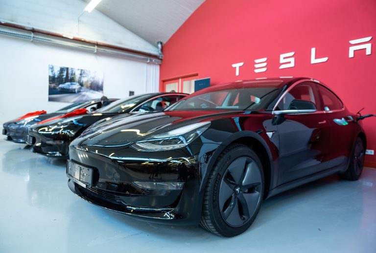 Tesla delivers a record 97,000 vehicles in third quarter, falling short of forecasts