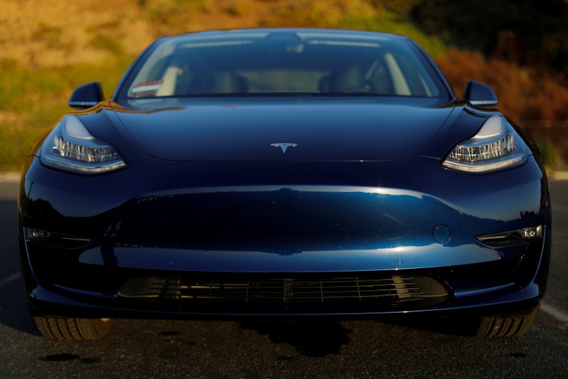 FILE PHOTO: A 2018 Tesla Model 3 electric vehicle is shown in Cardiff, California,