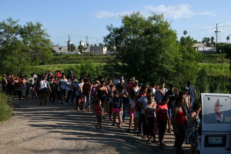 FILE PHOTO: Migrants, most of them asylum seekers sent back to Mexico from the U.S. under the 
