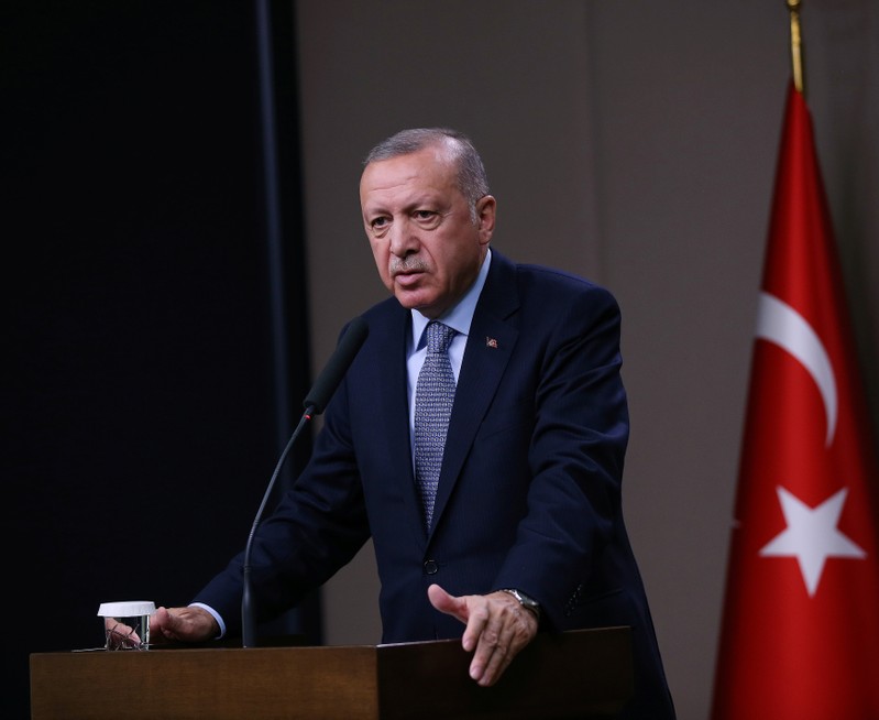 Turkish President Erdogan talks during a news conference at Esenboga International Airport in Ankara