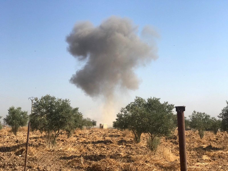 Smoke rises from Tel Arkam village in Ras al Ain countryside