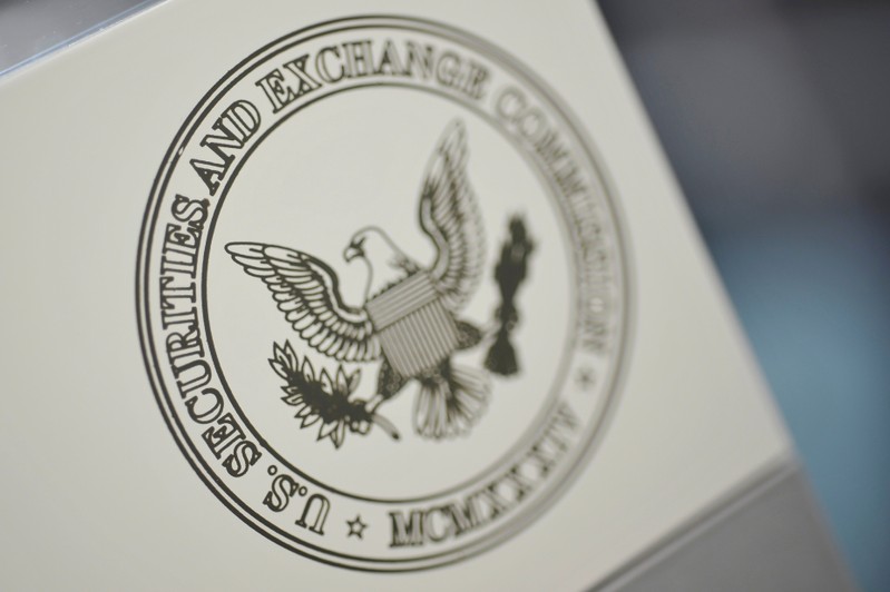 FILE PHOTO: The U.S. Securities and Exchange Commission logo adorns an office door at the SEC headquarters in Washington