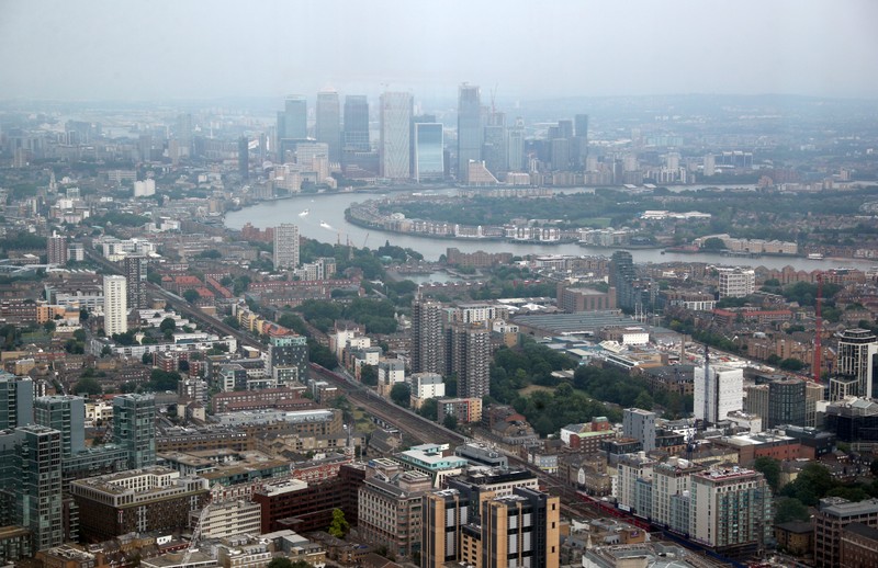 FILE PHOTO: The Canary Wharf financial district is seen from the construction site of 22 Bishopsgate in London