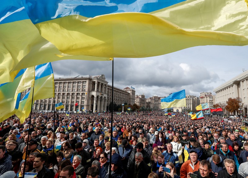 People attend a rally against approval of peace proposals for eastern Ukraine