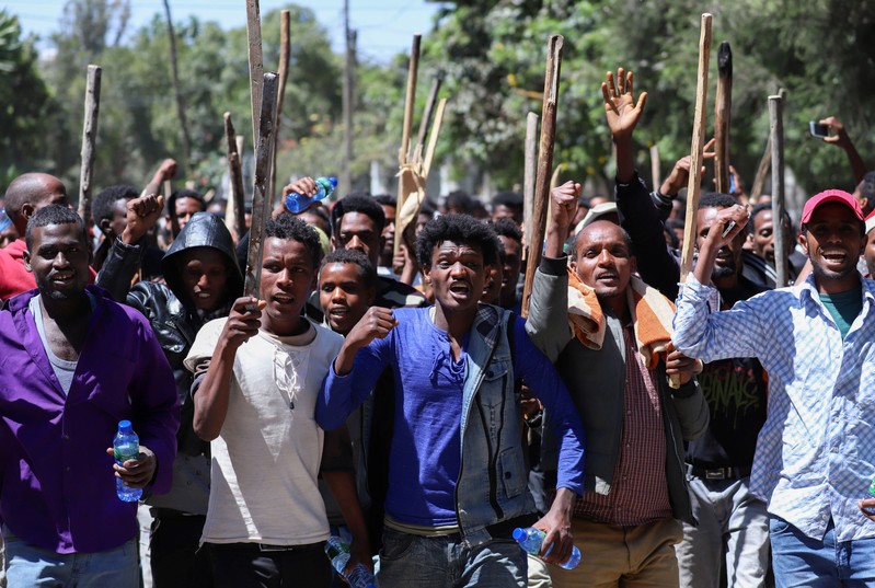 FILE PHOTO: Oromo youth chant slogans during a protest in-front of Jawar MohammedÕs house, an Oromo activist and leader of the Oromo protest in Addis Ababa
