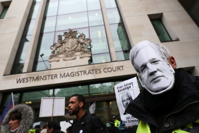 Supporters of WikiLeaks founder Julian Assange protest outside of Westminster Magistrates Court in London