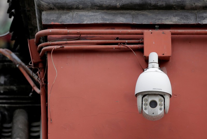 FILE PHOTO: A Hikvision surveillance camera is seen on the Drum Tower in downtown Beijing