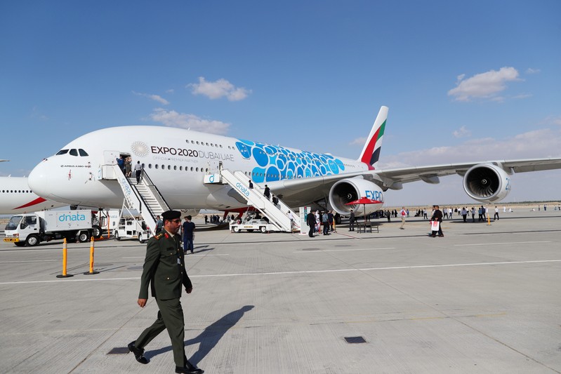 A visitor walks during the first day of Dubai Air Show in Dubai