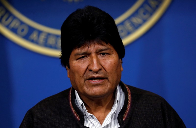 Bolivia's President Evo Morales addresses the media at the presidential hangar in the Bolivian Air Force terminal in El Alto