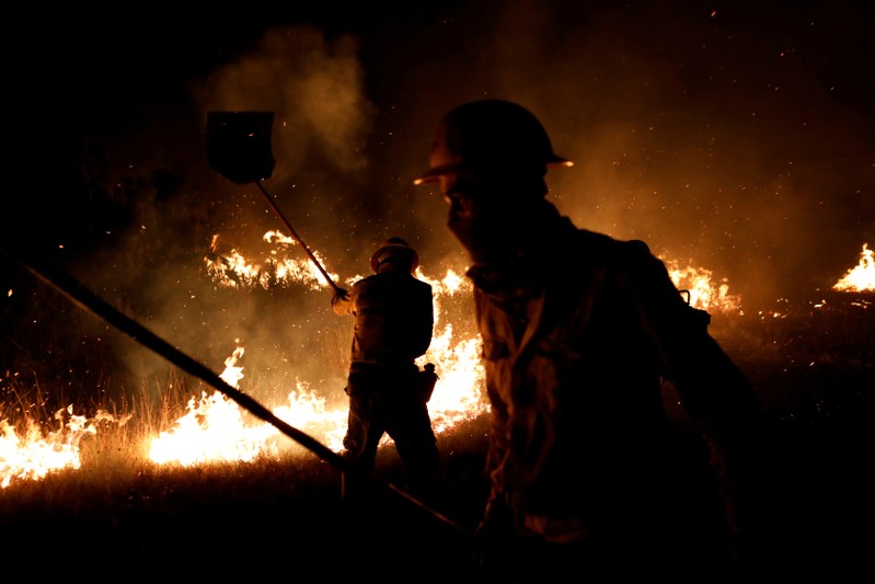 FILE PHOTO: IBAMA fire brigade members attempt to control hot points during a fire at Tenharim Marmelos Indigenous Land