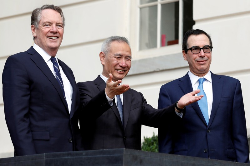 FILE PHOTO: U.S. Treasury Secretary Steve Mnuchin greets China's Vice Premier Liu He